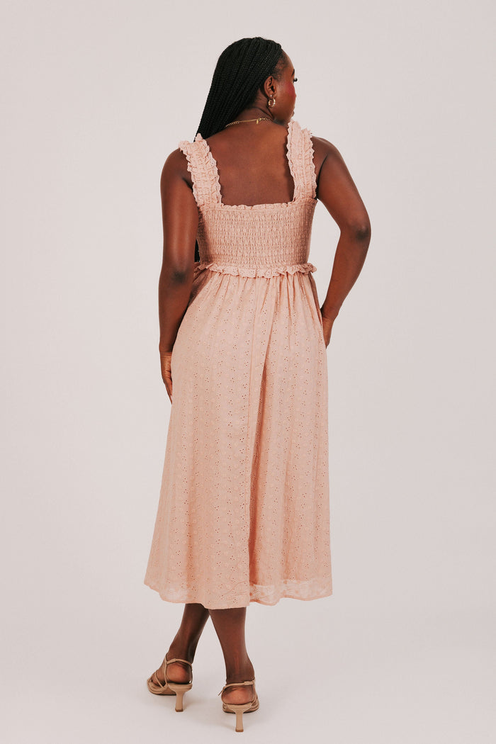 sunset colored midi dress with shirred bodice back