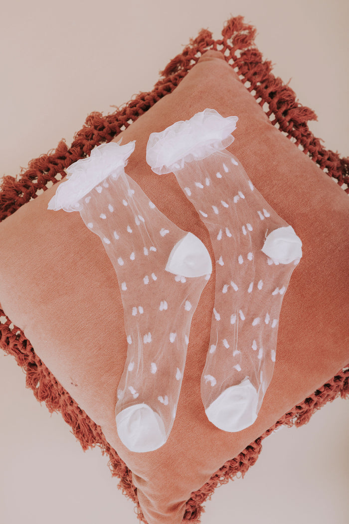 white mesh polka dot ruffled socks flatlay