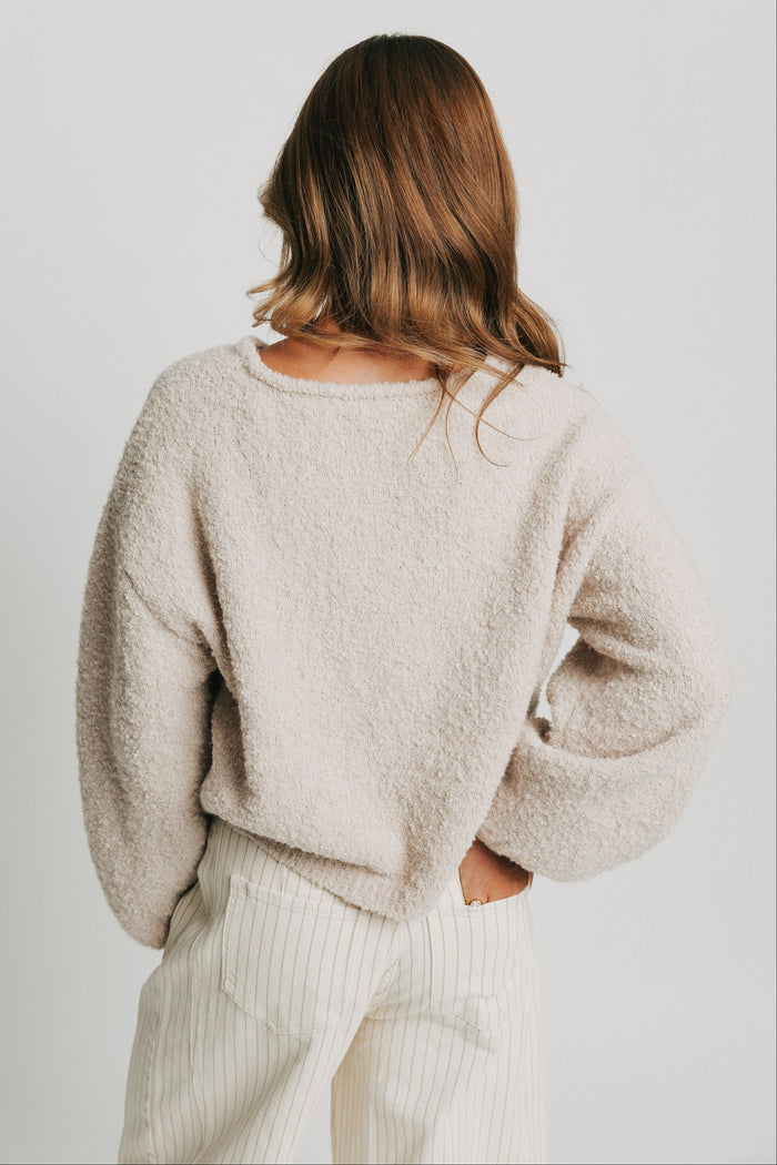cream sweater with lantern sleeves back