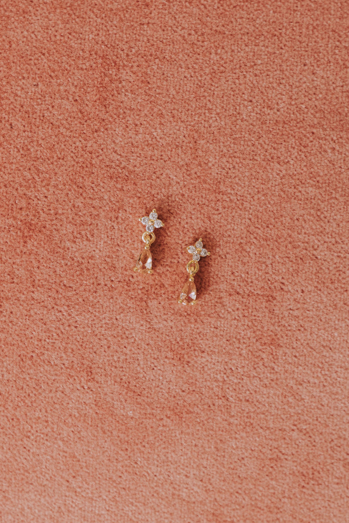 gold rhinestone dangle stud earring flatlay