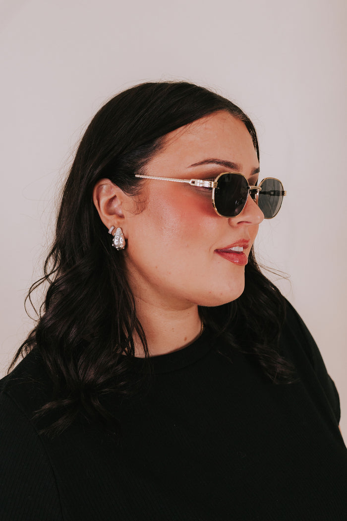 textured sunglasses gold trim black lenses