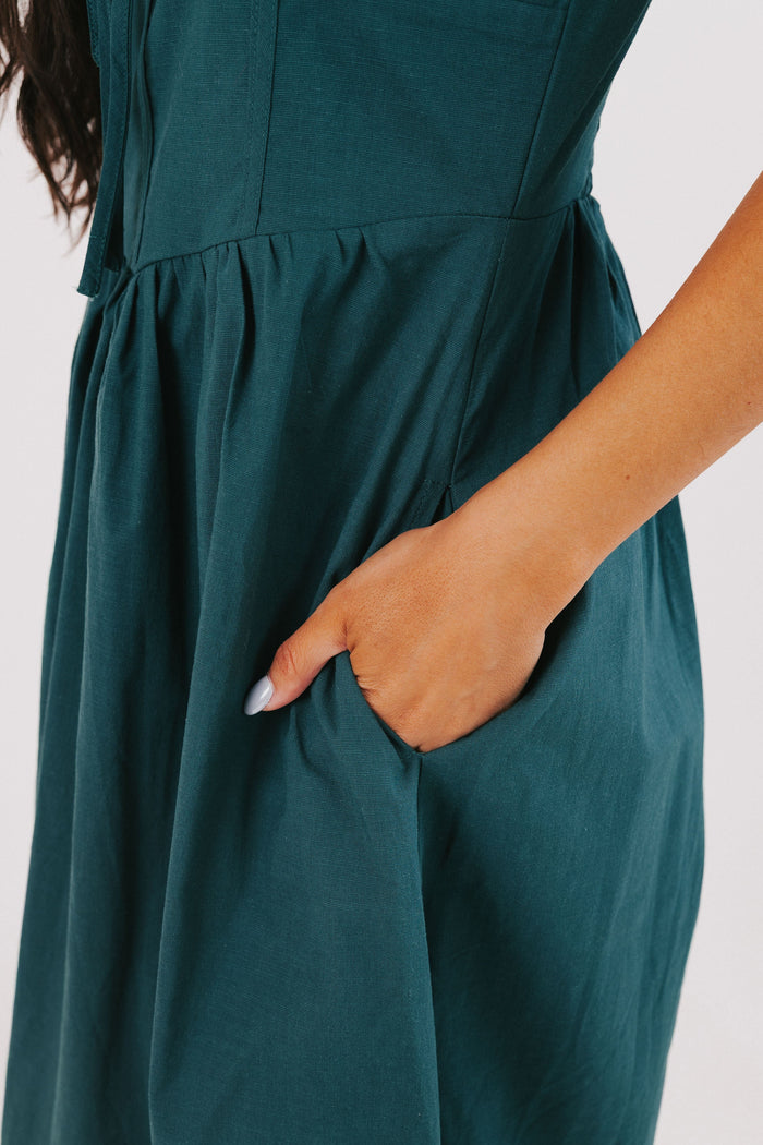 hunter green sleeveless v neck midi dress pockets