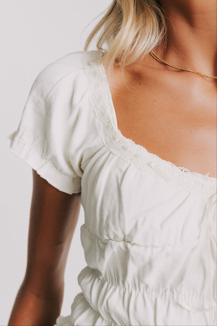 white ruched cropped shirt with puff sleeves close sleeves