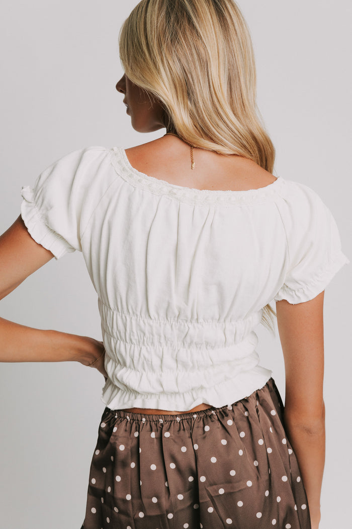 white ruched cropped shirt with puff sleeves back