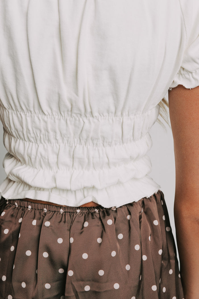 white ruched cropped shirt with puff sleeves back close