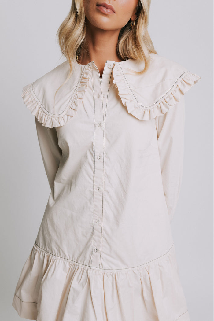 long sleeve ivory mini dress with ruffled trim collar close