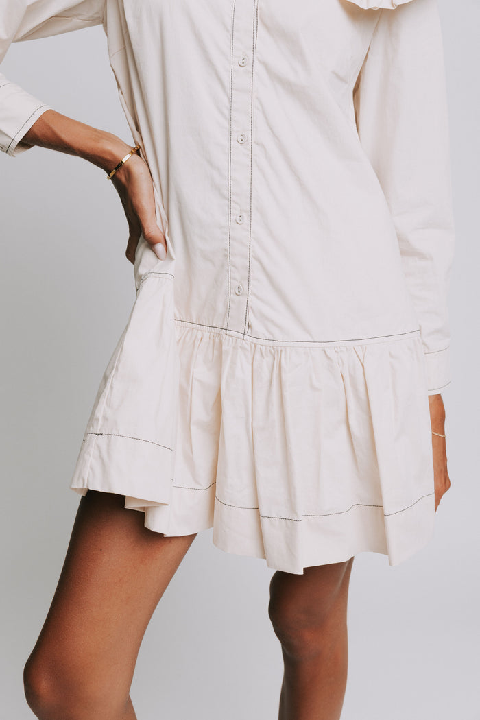 long sleeve ivory mini dress with ruffled trim collar front