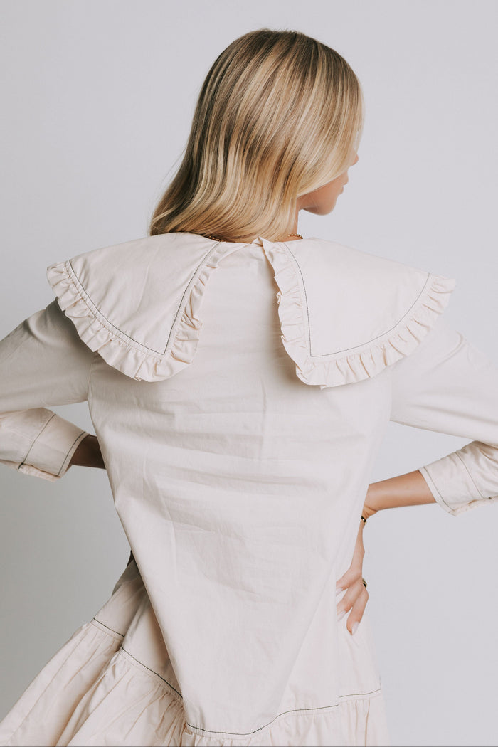 long sleeve ivory mini dress with ruffled trim collar back close